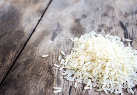 Rice on a wooden table.の写真素材