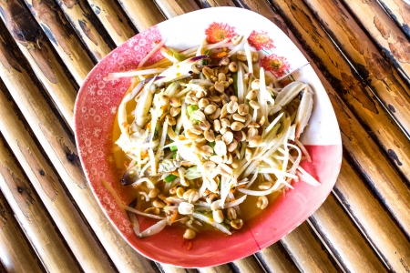 thai papaya salad hot and spicy mixed from variety of vegetable closeupの写真素材