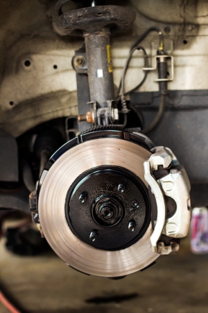 Detail of the wheel of a car with disc brakeの写真素材