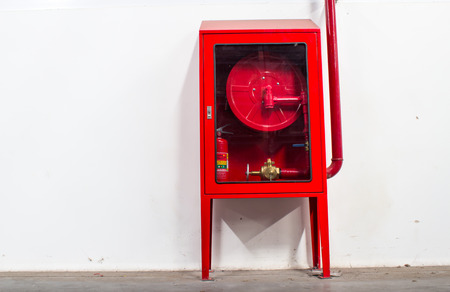 Hydrant with water hoses and fire extinguish equipmentの写真素材