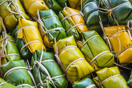 Thai style dessert, made from banana and glutinous rice, wrap with banana leafの写真素材