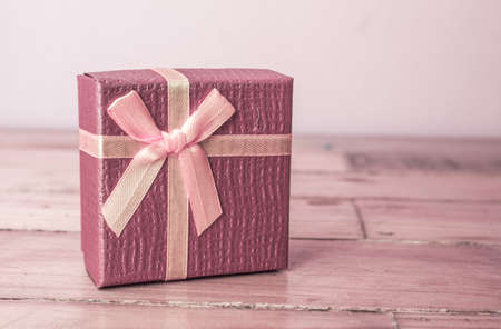 Vintage gift box on wooden backgroundの写真素材