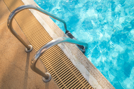 Hotel swimming pool with sunny reflectionsの写真素材