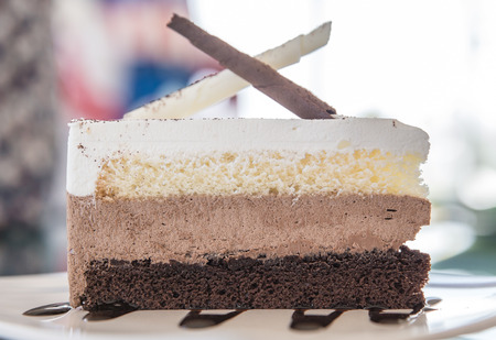 Chocolate cake with coffee on the tableの写真素材