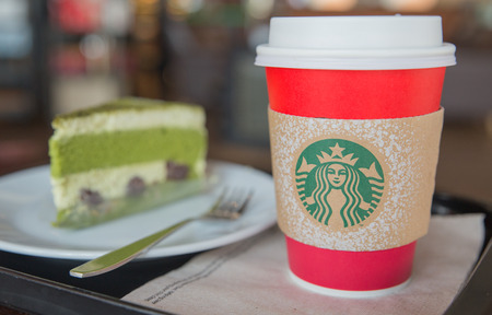 Bangkok ,Thailand-November 7 : Christmas theme of Starbucks Hot beverage coffee on table and cake on 7 November 2015 at Expressway Asia Center, Bangkok, Thailand.のeditorial素材