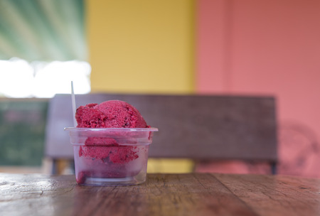 Red ice cream bowl on tabel.の写真素材