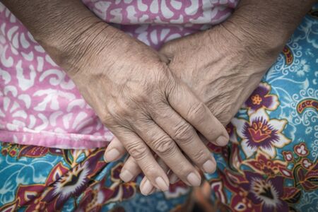 Aging process - very old senior woman hands wrinkled skinの写真素材
