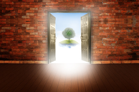 Open wooden door background of old vintage brick wall on woodの写真素材