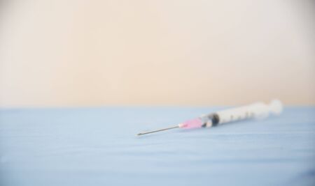injection needle on table backgroundの写真素材