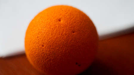 orange ball on a white background with a copy space, abstract  photoの写真素材