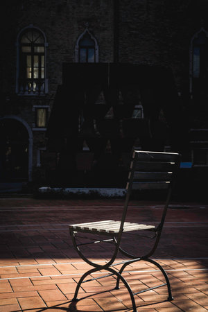 old garden chair lit by the sunの写真素材