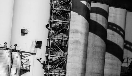 Gdansk shipyard, Poland. Retro style black and white. Cranes, old shipyard buildings, rusty structures.の写真素材