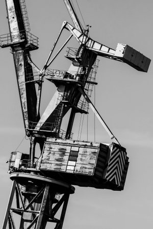 Gdansk shipyard, Poland. Retro style black and white. Cranes, old shipyard buildings, rusty...