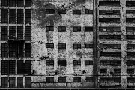 Gdansk shipyard, Poland. Retro style black and white. Cranes, old shipyard buildings, rusty structures.の写真素材