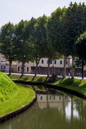 Water canal under the walls of the city of Cittadella, Padua province, Italyの写真素材