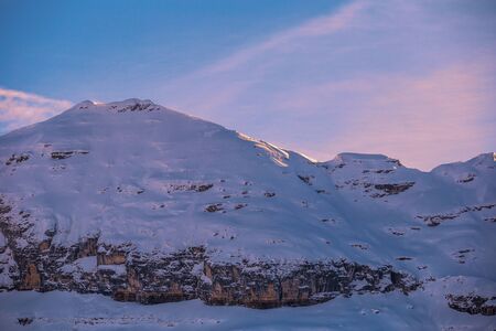 Colored sky at sunset sunset in snowy mountains. Flaine, Grand Massif, Franceの写真素材