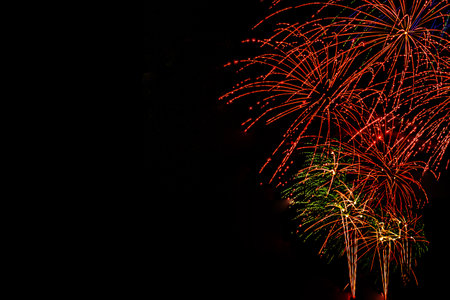 Fireworks banner. Copy space. New Year and Celebration banner. Sparks salute isolated on black...