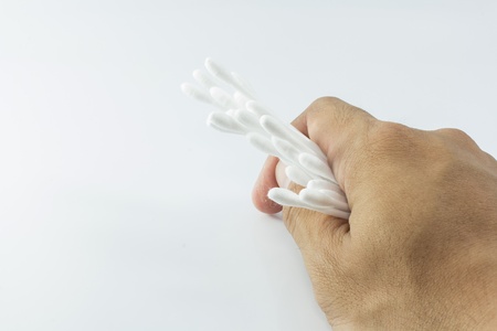 Hand with cotton-budsの写真素材