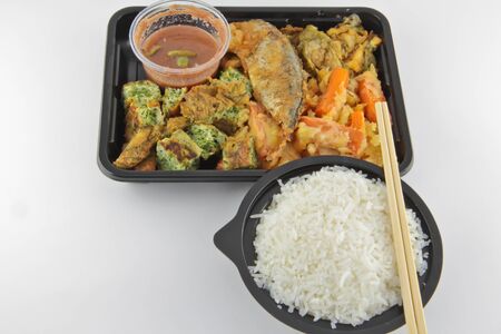 Chilli sauce, fried mackerel, fried vegetable and rice from the market in Bangkok, Thailandの写真素材