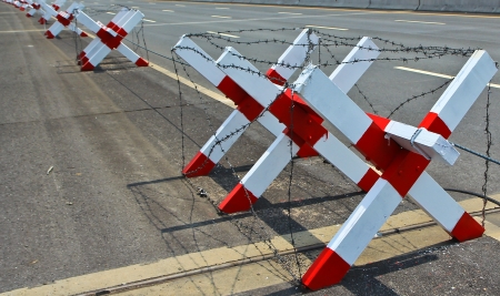 Barbed wire blocking the road  の写真素材
