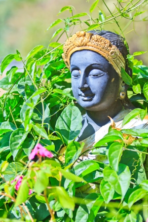 Statue of a thai buddhist image at the gardenの写真素材