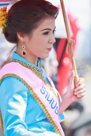 CHIANG MAI, THAILAND-JANUARY 19   30th anniversary Bosang umbrella festival,Woman in traditional costume during the annual Umbrella festival at San Kamphaeng  on Jan 19, 2013 in Chiang Mai, Thailand  のeditorial素材