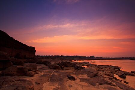 sunset rock holes  stone View Sam-Pan-Bok Grand Canyon in thailand の写真素材