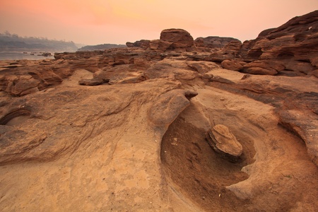 sunset rock holes  stone View Sam-Pan-Bok Grand Canyon in thailand の写真素材