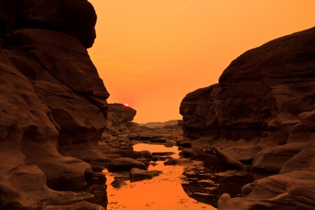 sunset rock holes  stone View Sam-Pan-Bok Grand Canyon in thailand の写真素材