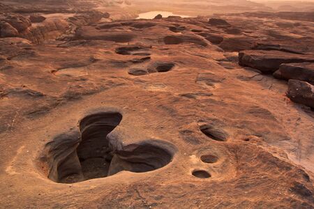 sunset rock holes  stone View Sam-Pan-Bok Grand Canyon in thailand の写真素材