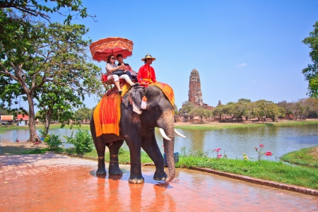 AYUTTHAYA, THAILAND - MARCH 7  Tourists on an elephant ride tour of the ancient city on March 7, 2013 in Ayutthaya  のeditorial素材