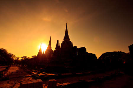 Silhouette of Pagoda at wat Phra sri sanphet temple thailandの写真素材