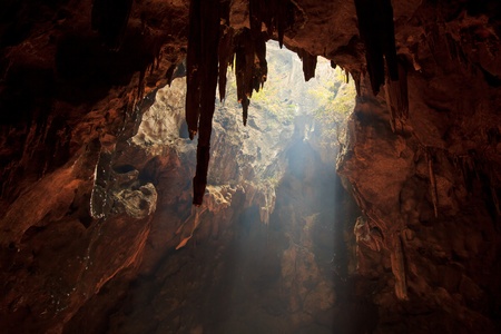 Sun rays in cave in phetchaburi province asia thailand の写真素材