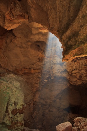 Sun rays in cave in phetchaburi province asia thailand の写真素材