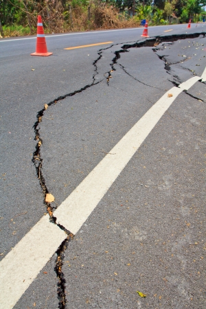 Cracked surface of an asphalt road の写真素材