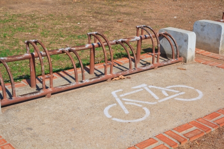 A sign of bicycle path and Parking