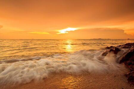 Wave beach and sea sunset の写真素材