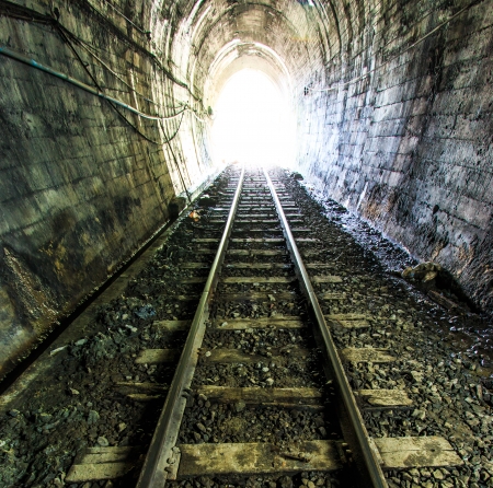 Light at the end of railroad tunnel  Natural lighting  の写真素材