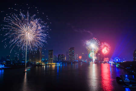 Beautiful colorful holiday fireworks on the black sky backgroundの写真素材