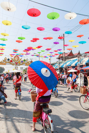 CHIANG MAI, THAILAND-JANUARY 19   31th anniversary Bosang umbrella festival,Women in traditional costume during the annual Umbrella festival at San Kampaeng  on Jan 19, 2014 in Chiang Mai, Thailand  のeditorial素材