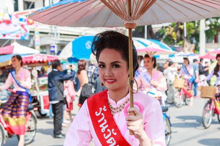 CHIANG MAI, THAILAND-JANUARY 19   31th anniversary Bosang umbrella festival,Women in traditional costume during the annual Umbrella festival at San Kampaeng  on Jan 19, 2014 in Chiang Mai, Thailand  のeditorial素材