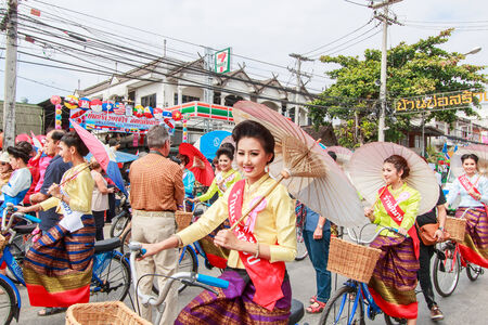 CHIANG MAI, THAILAND-JANUARY 19   31th anniversary Bosang umbrella festival,Women in traditional costume during the annual Umbrella festival at San Kampaeng  on Jan 19, 2014 in Chiang Mai, Thailand  のeditorial素材