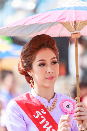 CHIANG MAI, THAILAND-JANUARY 19   31th anniversary Bosang umbrella festival,Women in traditional costume during the annual Umbrella festival at San Kampaeng  on Jan 19, 2014 in Chiang Mai, Thailand  のeditorial素材