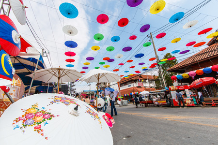CHIANG MAI, THAILAND-JANUARY 19   31th anniversary Bosang umbrella festival,Women in traditional costume during the annual Umbrella festival at San Kampaeng  on Jan 19, 2014 in Chiang Mai, Thailandのeditorial素材