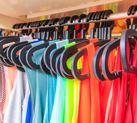 Fashion clothing on hangers の写真素材