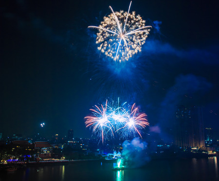 Beautiful colorful holiday fireworks on the black sky backgroundの写真素材