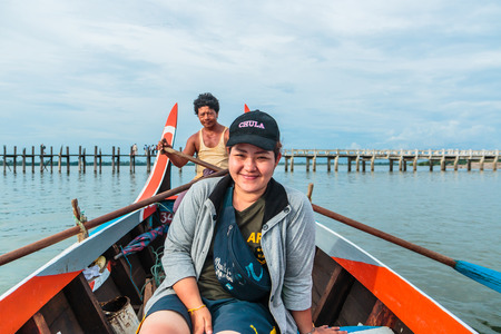 AMARAPURA, MYANMAR - Aug 26th, 2014: An unidentified man rows his boat on Aug 26th, 2014: in Amarapura, Myanmar. Amarapura is famed for the longest teak bridge in the world.のeditorial素材