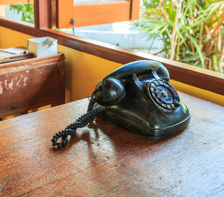 Old Phone on old deskの写真素材