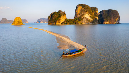 Long tail boat parked on Sand dunes in the sea and islands, in Phang Nga Bay of Phang Nga Province, southern Thailand, Asia.の写真素材
