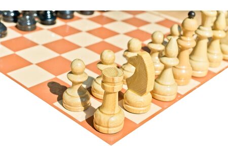 Chess pieces on board isolated on white background